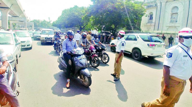 Commuters stopped for the VIP movement during the Assemble session in city on Tuesday.  (Photo: DC)
