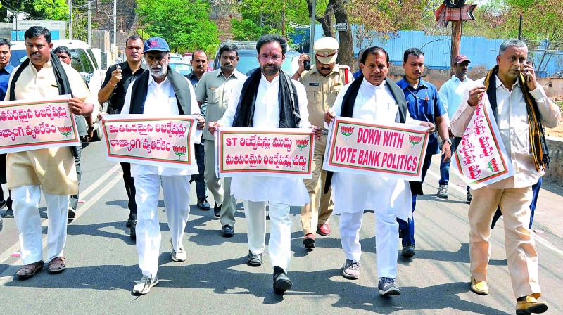 BJP MLAs stage protest against Muslim reservation Bill after they were suspended from the State Assembly in Hyderabad on Sunday. (Photo: DC)