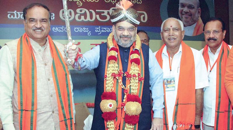 BJP national president Amit Shah, state president B. S. Yeddyurappa, party MP Ananth Kumar and others during a meeting in Bengaluru on Sunday. (Photo: PTI)