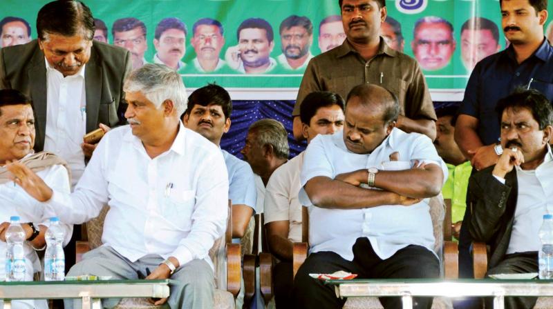 Chief Minister H.D. Kumaraswamy, JD(S) candidate for the Mandya Lok Sabha seat L.R. Shivaramegowda (left) and Minister C.S. Puttaraju (middle) in a file photo.