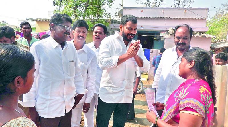 Nellore City legislator Dr P Anilkumar Yadav is seen greeting a woman during a visit to 13th division in Nellore City on Tuesday. (Photo: DC)