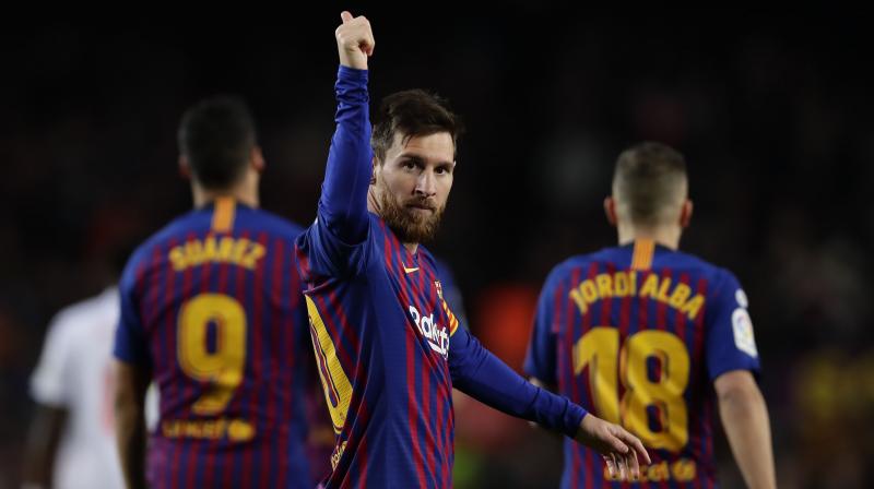 Messi drove the ball into the bottom corner after being teed up by Luis Suarez, who added two goals to his own tally either side of the Argentinian marking another historic record at the Camp Nou. (Photo: AP)