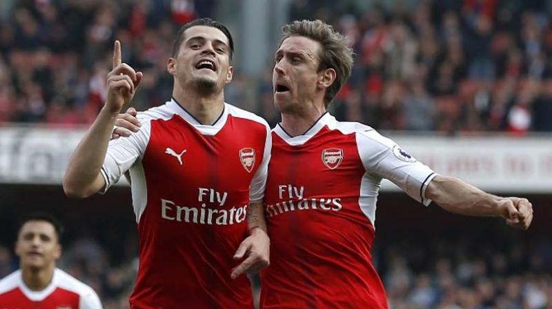 Goals from Granit Xhaka and Danny Welbeck improved Arsenals chances of salvaging a troubled season by finishing in the top four. (Photo: AFP)