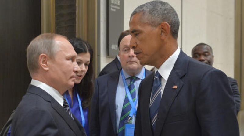 Russian President Vladimir Putin, left, speaks with U.S. President Barack Obama. (Photo: AP)
