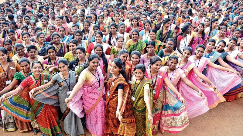 Students of Valliammai College for Women, Anna Nagar, clad in handloom sarees as part of Pongal celebrations on Monday. (Photo: DC)