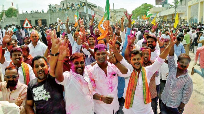 People celebrate the victory of their candidates in urban local body polls in Raichur on Monday 	(Photo: KPN)