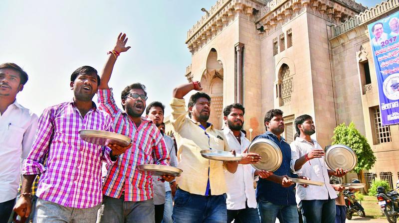 OU students protest against the governments failure to clear fee reimbursement arrears in front of the Arts College in Hyderabad on Friday. (Photo: DC)