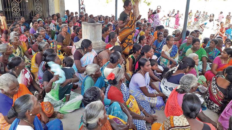 Women agitating inside Kazhaniappar Ayyanar temple on Sunday. (DC)
