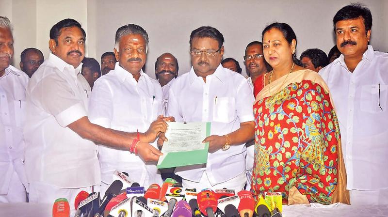 Chief Minister K. Palaniswami, Deputy CM O. Panneerselvam, DMDK leader Vijayakanth and DMDK treasurer and his wife Premalatha during an electoral pact in Chennai on Sunday. 	(DC)