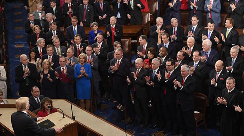 Trump delivered his primetime address in the hallowed House of Representatives chamber, where immigrants from Chile, Guatemala, Mexico and South Korea joined US lawmakers. (Photo: AFP)