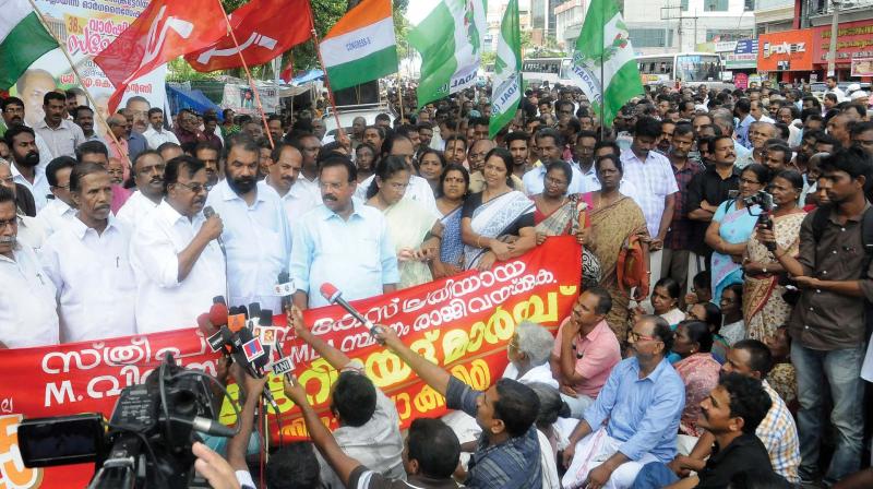 CPI leader C. Divakaran inaugurates a demonstration by LDF seeking the resignation of M. Vincent, MLA, who faces rape charges in Thiruvananthapuram on Tuesday. (Photo: DC)