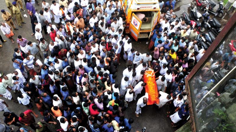 BJP leaders gather to receive the body of an RSS worker who was allegedly killed by CPM workers in Kannur.