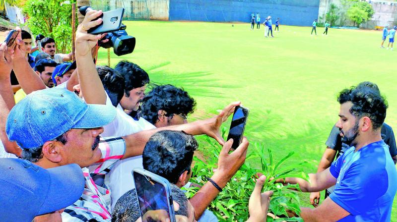 India opener Rohit Sharma signs autographs during a training session in Visakhapatnam on Saturday.  (K. Murali Krishna)