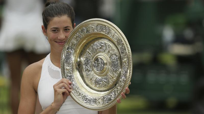 The Spaniard  defeated Venus Williams in the finals to clinch the womens singles title. (Photo: AP)