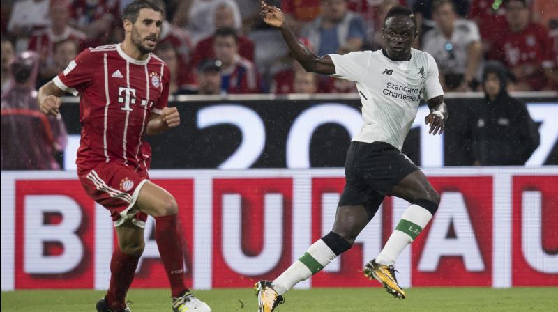 Bayern Munichs Javi Martinez, left, and Liverpools Sadio Mane vie for the ball during the Audi Cup semifinal soccer match between FC Bayern Munich and Liverpool FC. (Photo: AP)