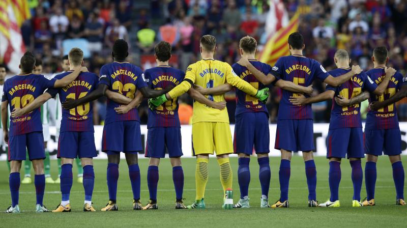A minutes silence was held before kick-off, whilst Barcelona players wore black armbands and shirts with Barcelona replacing individual names on the back. (Photo: AP)
