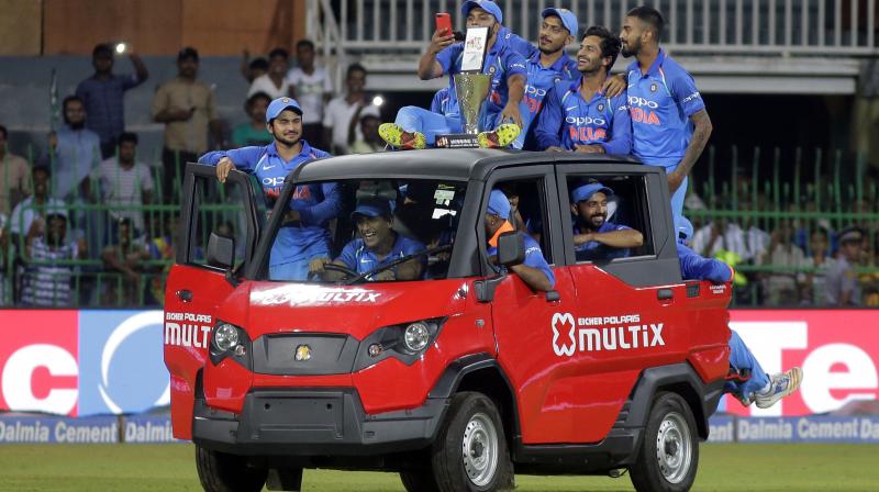 The former India skipper gave fans a nostalgic moment as he took Virat Kohli and co for a ride in Jasprit Bumrahs man-of-the-match awarded car. (Photo: AP)