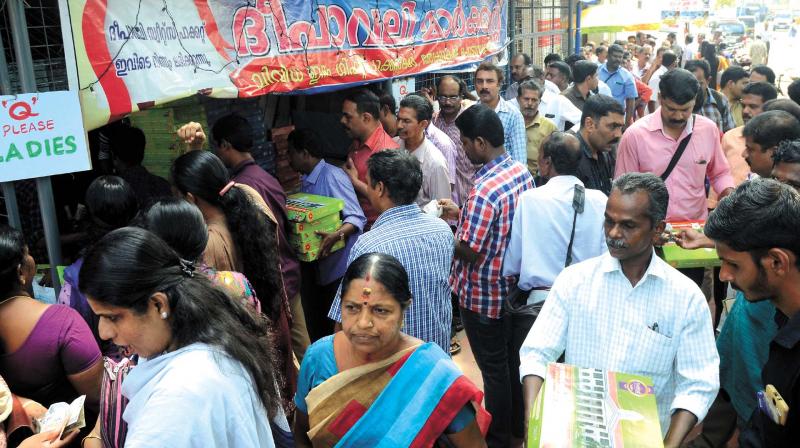 Residents queuing at a craker shop run by secretariat staff coperative society on the eve of Deepavali in Thiruvananthapuram on Friday.   (Photo: PEETHAMBARAN PAYYERI)