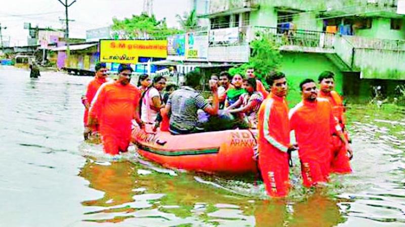 Water world: People being evacuated in Chennai.