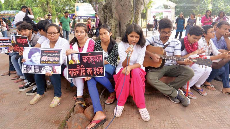 Students stage a sit-in demonstration to protest against the killing of journalist Gauri Lankesh, in front of Nehru Park in Guwahati on Saturday. (Photo: PTI)