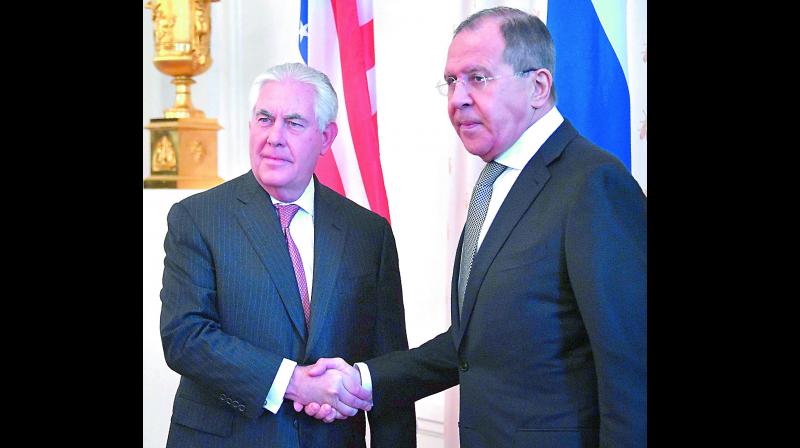 Russian foreign minister Sergei Lavrov (R) shakes hands with US secretary of state Rex Tillerson during a meeting in Moscow.