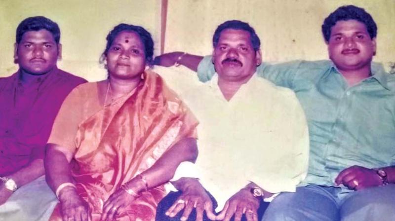 Sugathan (second from right) with wife Sarasamma, sons Sunil Kumar and Sujith Kumar