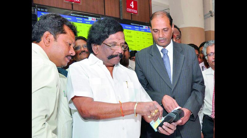 Minister Siddha Raghava Rao launches e-PoS machines at the RTC bus station in Vijayawada on Thursday. (Photo: DC)