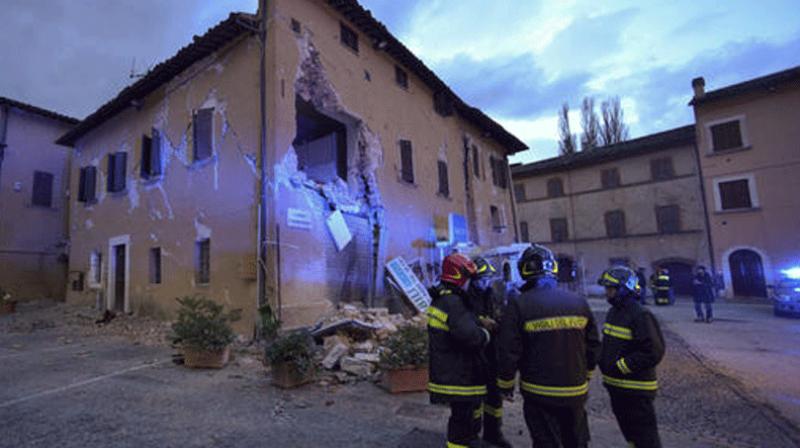 After a night of heavy rain, rescuers workers were trying to assess the full extent of the latest disaster in central Italy, which toppled buildings and injured dozens. (Photo: AP)