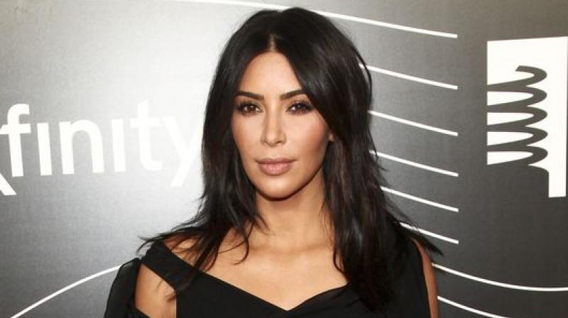 Kim Kardashian was robbed of millions at gunpoint at a luxury residence in Paris by masked men dressed as police officers on October 3. (Photo: AP)
