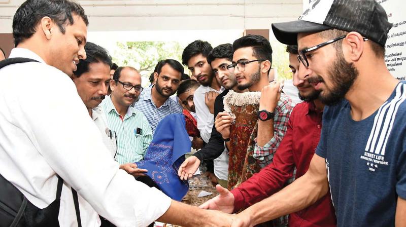 Collector Seeram Sambashiva Rao greets students from Kashmir on Friday. (DC)