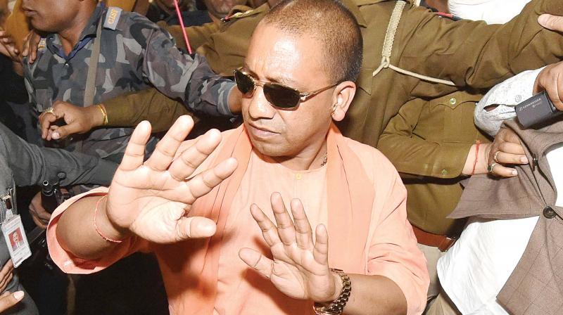Yogi Adityanath arrives for the BJPs legislature party meeting in Lucknow on Saturday, where he was elected the BJPLP leader. (Photo: PTI)