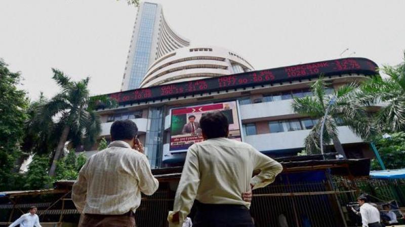 Investors at BSE check changing share prices. (Photo: PTI)