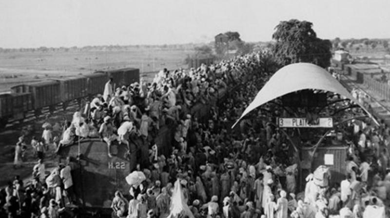 Refugees atop an overcrowded coach of train leaving New Delhi for Pakistan in September 1947.
