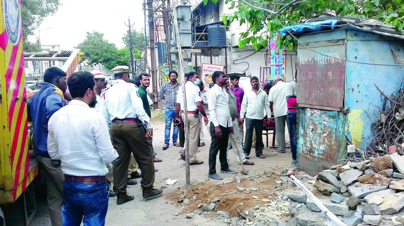 The GHMC North Zone and Traffic Police Marredpally demolishing illegal encroachments on Saturday.