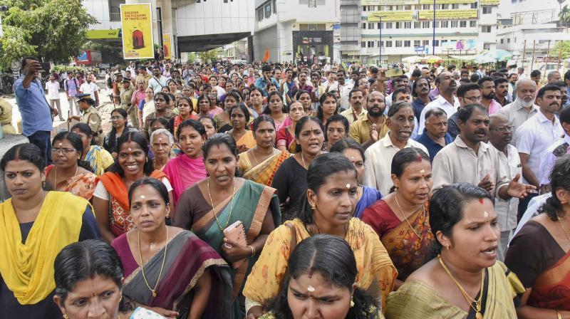 The faithful, a large number of them women, urged both the Central and the state governments to intervene in the matter to protect the sanctity of the centuries-old rituals and traditions of the hill shrine. (Photo: File/PTI)