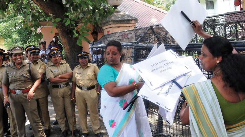 Mahila Congress leaders put up placards on the police barricades ahead of their protest demanding action against CPM MLA P.K. Sasi in front of MLA hostel in Thiruvananthapuram on Thursday. (Photo:A.V. MUZAFAR)