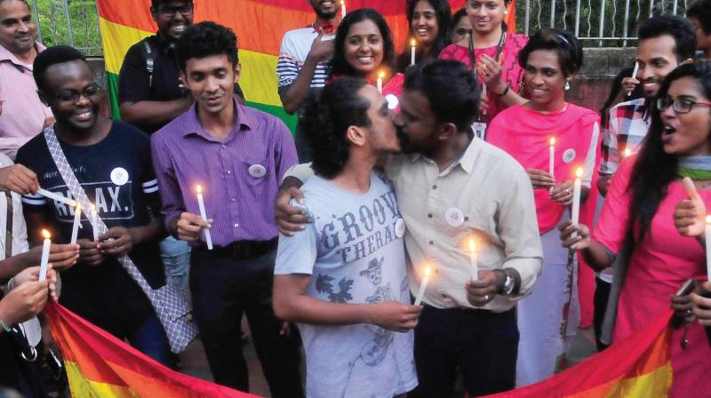 LGBT members kiss each other on Thursday after consensual same-sex relationships between adults was decriminalised.  (Photo:A.V. MUZAFAR)