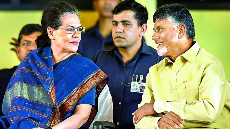 Former Congress president Sonia Gandhi along with AP Chief Minister N. Chandrababu Naidu at a meeting after unveiling a bronze statue of former DMK president late M. Karunanidhi, in Chennai, on Sunday.  (PTI)