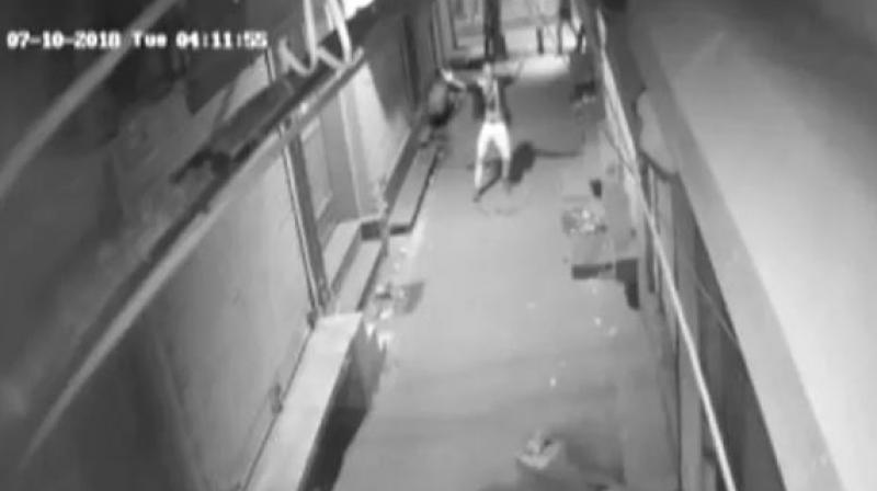 A thief captured on CCTV dancing in the middle of night in a deserted lane in Delhi. (Photo: Screengrab | ANI)