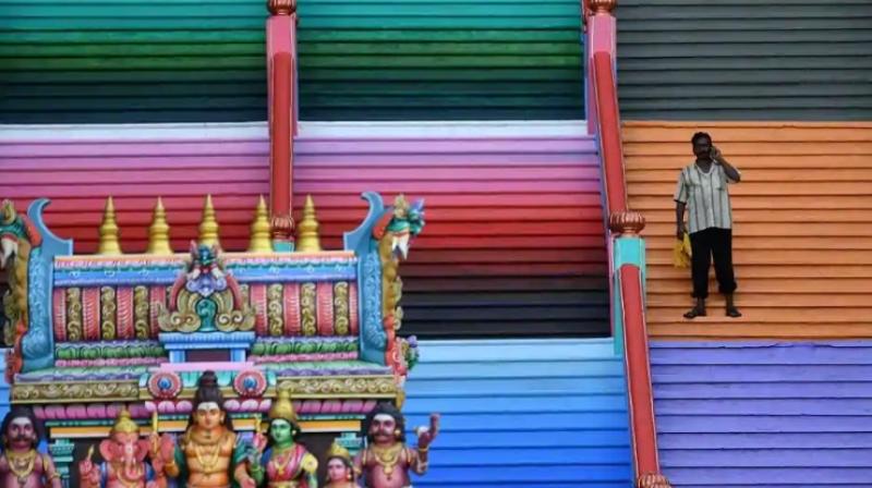 The steps of the temple have been painted in a kaleidoscope of bright colours ahead of a Hindu ritual that is conducted in temples every 12 years, which will take place Friday. (Photo: AFP)