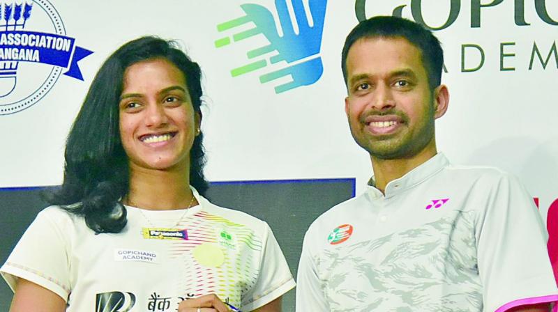 P. V. Sindhu with Pullela Gopichand in Hyderabad on Tuesday. (Photo: R. Pavan)