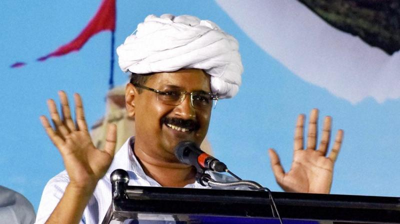 AAP chief and Delhi Chief Minister Arvind Kejriwal addressing at a public meeting in Surat. (Photo: PTI)