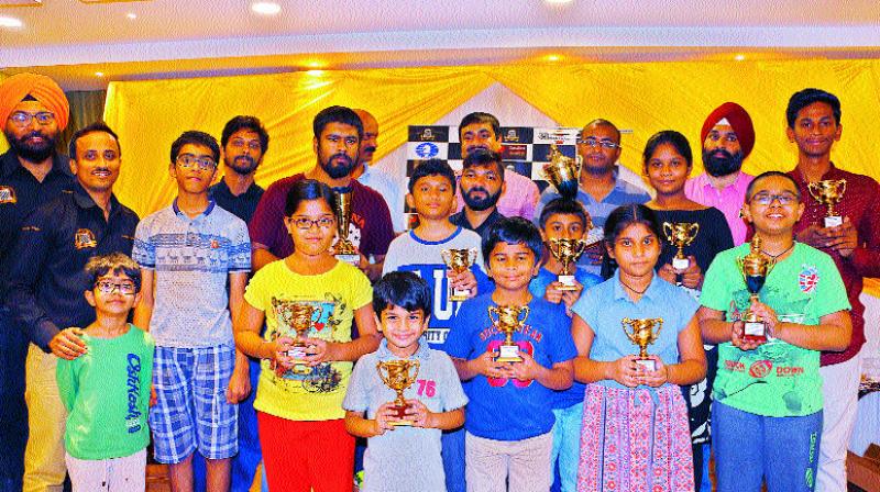 Winners pose with the trophies they secured in Amanthran Rapid and Blitz Chess tournament played at Amanthran hotel in Hyderabad.