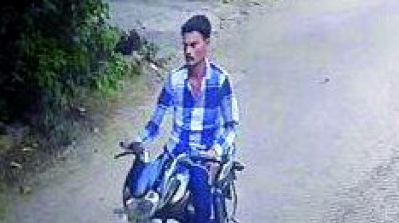 A CCTV image of the suspect travelling on a bike.