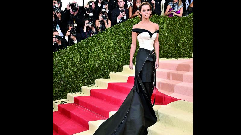 Emma Watson in a custom Calvin Klein, made with fabric crafted from recycled plastic bottles.