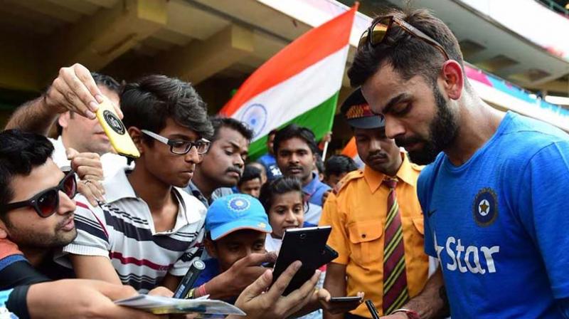 While many of the other cricketers, including MS Dhoni refused to give autographs, Kohli was quick to respond.(Photo: AFP)
