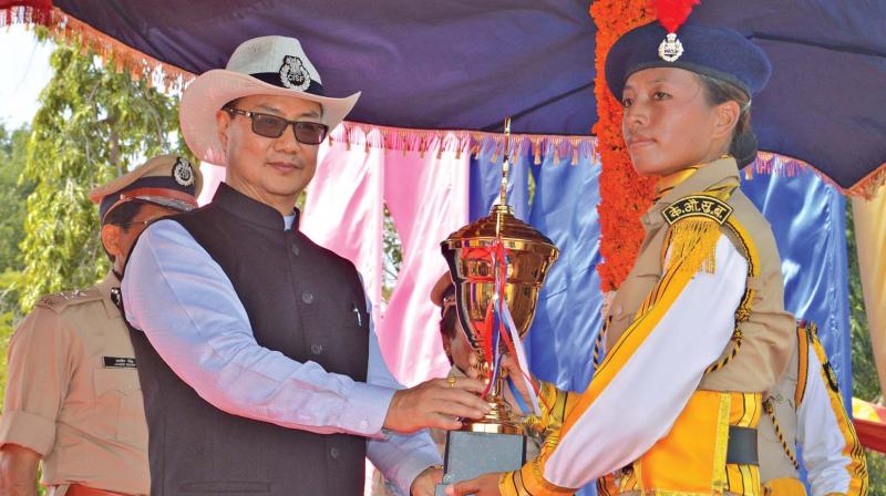 Union minister Kiren Rijiju presents a trophy  at the CISF passing out parade on Sunday.(Photo: K. Senthilnathan)