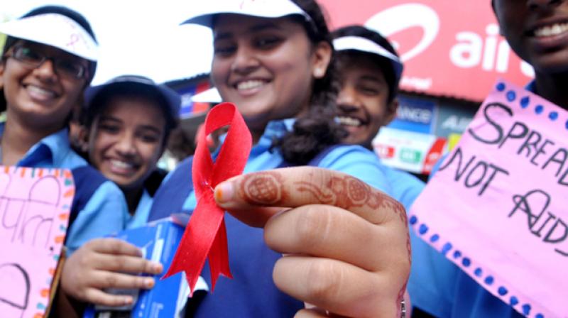 A School girl displays a red ribbon (Representational Image)