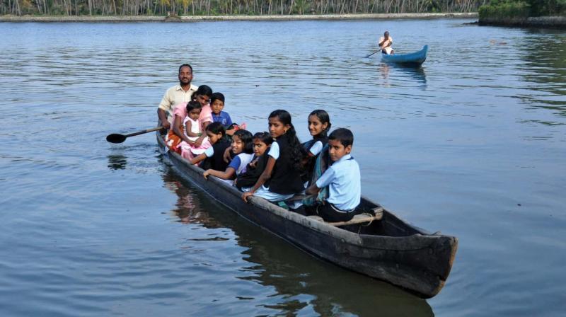 ten children, five of them girls, of Mukkathukariyil Island, West of Poothotta in Udayamperoor panchayat risk their lives to cross three kilometres in Vembanad lake in ramshackle country boats to reach the mainland school.