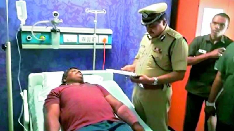 Rachakonda police commissioner Mahesh Bhagawat visits injured constable S. Ramesh in hospital. (Photo: DC)